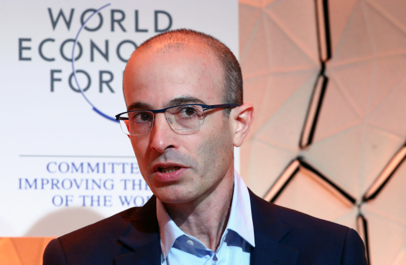 Yuval Noah Harari of Hebrew University of Jerusalem attends a session at the 50th World Economic Forum (WEF) annual meeting in Davos, Switzerland, January 21, 2020 (credit: REUTERS/DENIS BALIBOUSE)