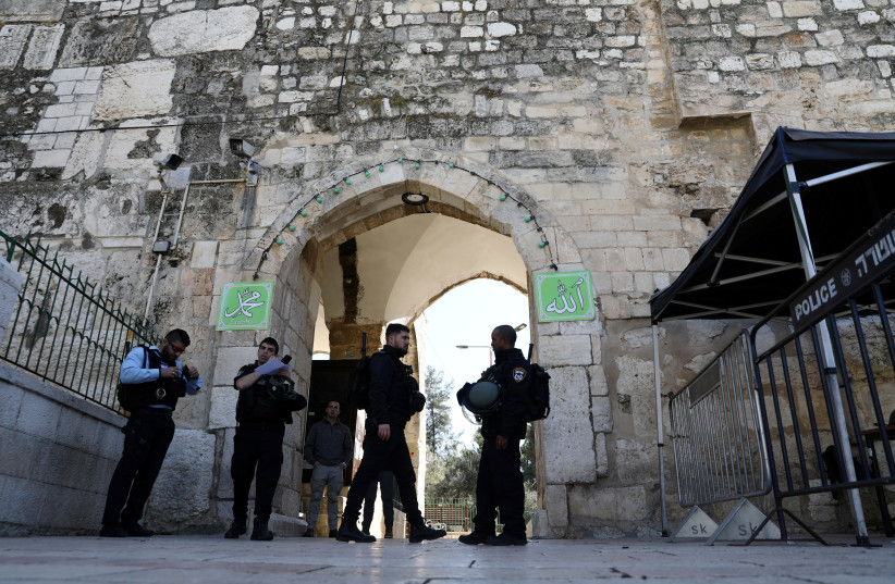 Israeli police officers secure the area following a suspected shooting attack in which an Israeli policeman was injured lightly near the entrance to the compound known to Muslims as the Noble Sanctuary and to Jews as Temple Mount in Jerusalem's Old City February 6, 2020 (photo credit: AMMAR AWAD/REUTERS)