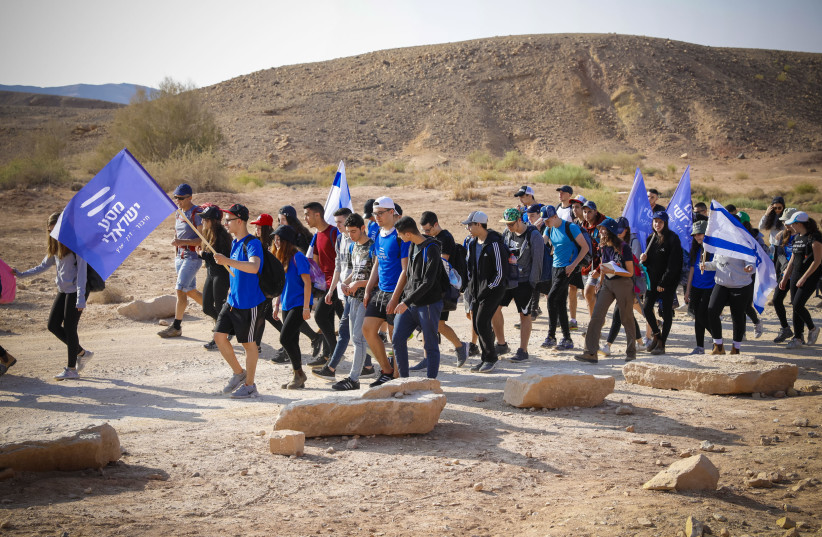 MASA ISRAELI participants at the Khan Be’erot camping area at the Ramon Crater (Makhtesh Ramon). (photo credit: GUY YEHIELI)