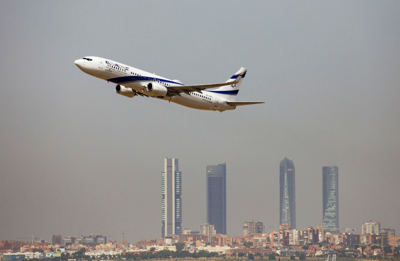 An El Al Israel Airlines Boeing 737-900ER airplane takes off from the Adolfo Suarez Madrid-Barajas airport as seen from Paracuellos del Jarama, outside Madrid, Spain, August 8, 2018 (credit: REUTERS/PAUL HANNA)