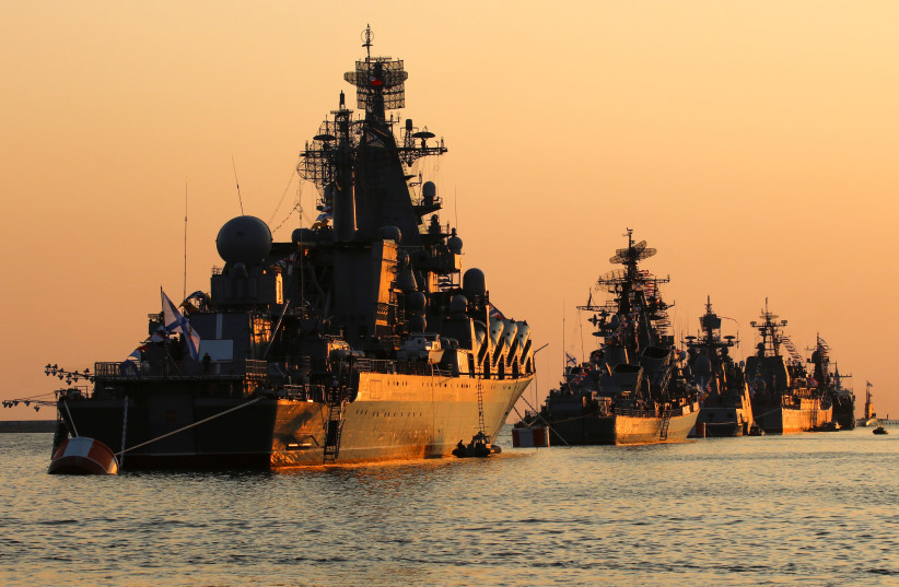 A view shows Russian warships on sunset ahead of the Navy Day parade in the Black Sea port of Sevastopol, Crimea July 27, 2019 (credit: REUTERS/ALEXEY PAVLISHAK)