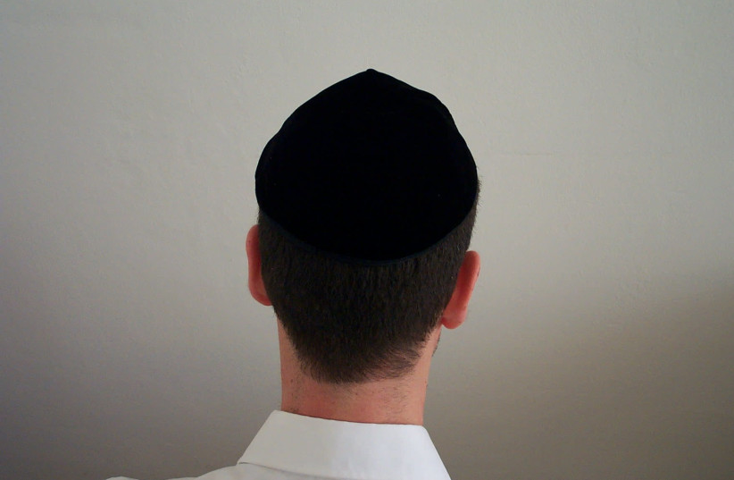 A man wears a black kippah. (credit: Wikimedia Commons)