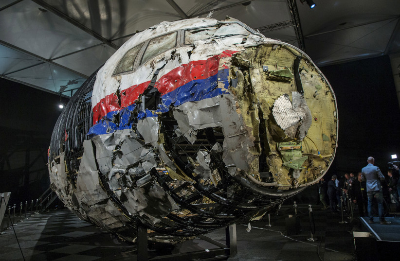 The reconstructed wreckage of the MH17 airplane is seen after the presentation of the final report into the crash of July 2014 of Malaysia Airlines flight MH17 over Ukraine, in Gilze Rijen, the Netherlands, October 13, 2015. (credit: MICHAEL KOOREN / REUTERS)