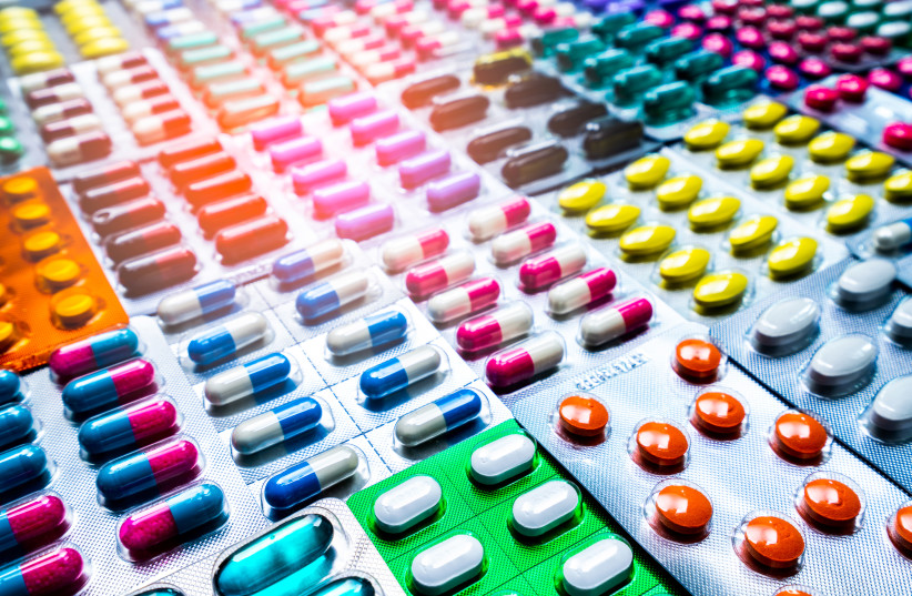 Colorful of tablets and capsules pill in blister packaging arranged with beautiful pattern with flare light. Pharmaceutical industry concept. Pharmacy drugstore. Antibiotic drug resistance (photo credit: INGIMAGE)