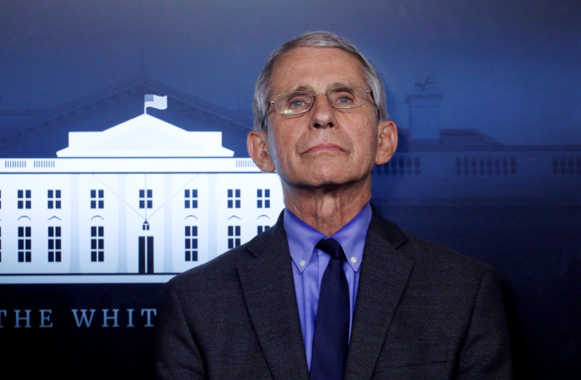 National Institute of Allergy and Infectious Diseases Director Dr. Anthony Fauci attends the daily coronavirus task force briefing at the White House in Washington, U.S., April 13, 2020 (photo credit: REUTERS/LEAH MILLIS)