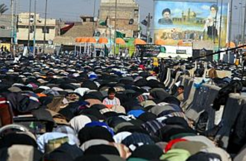 iraq prayer 88.298 (photo credit: AP)
