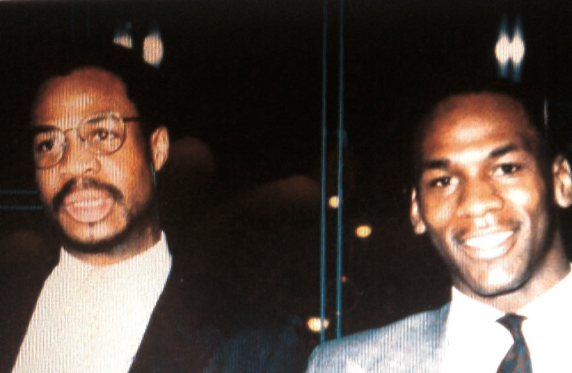 A young Gene Banks (left) poses with Michael Jordan (right) while both were in the NBA with the Chicago Bulls in the mid-1980s (credit: Courtesy)