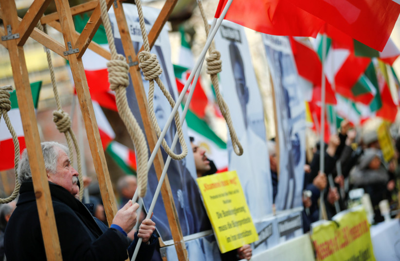 Activists protest against Iranian government in front of German Federal Foreign Office after a Ukrainian passenger plane crashed in Iran, in Berlin, Germany, January 13, 2020 (photo credit: HANNIBAL HANSCHKE/REUTERS)