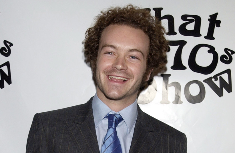 Cast member Danny Masterson poses for photographers during a celebration of ''That '70s Show'' 100th episode, in Los Angeles April 10, 2002.