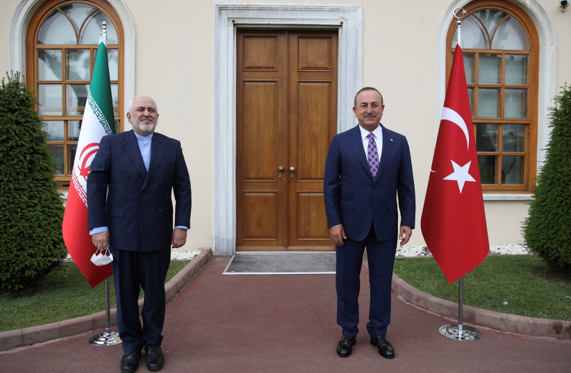 Turkish Foreign Minister Mevlut Cavusoglu meets with his Iranian counterpart Javad Zarif in Istanbul, Turkey June 15, 2020. (photo credit: REUTERS)
