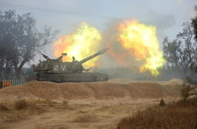 IDF Artillery Corps fires 155 mm M-109 howitzer gun during Operation Protective Edge, Gaza, 2014 (credit: IDF SPOKESPERSON'S UNIT)