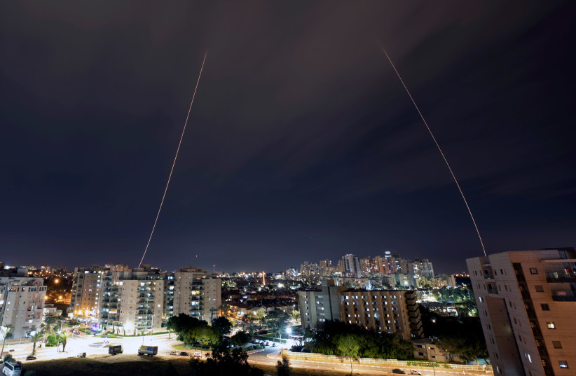 Iron Dome anti-missile system fires interception missiles as rockets are launched from Gaza towards Israel, in the city of Ashkelon, Israel, February 23, 2020 (photo credit: REUTERS/AMIR COHEN)