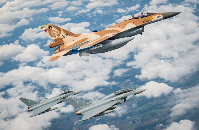 A pair of two German Air Force Eurofighter jets seen along with an Israeli Air Force F-16D from the Scorption Squadron