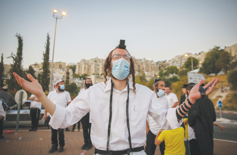 A BRESLOV HASSID in Safed joins a protest last week to demand a solution that will allow flights to Uman.  (photo credit: DAVID COHEN/FLASH 90)