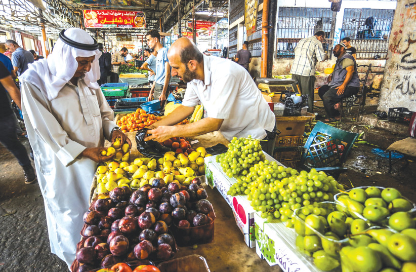 THE MAIN concern of most Palestinians today is clearly the worsening economic reality. A market in Rafah, in the southern Gaza Strip.