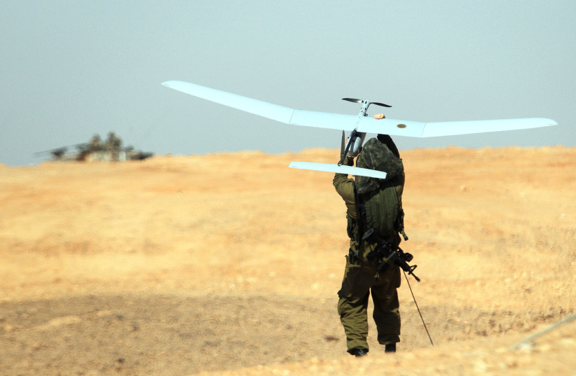 A SKYLARK drone is thrown by an IDF soldier during a military exercise in southern Israel in 2013 (credit: IDF SPOKESPERSON'S UNIT)