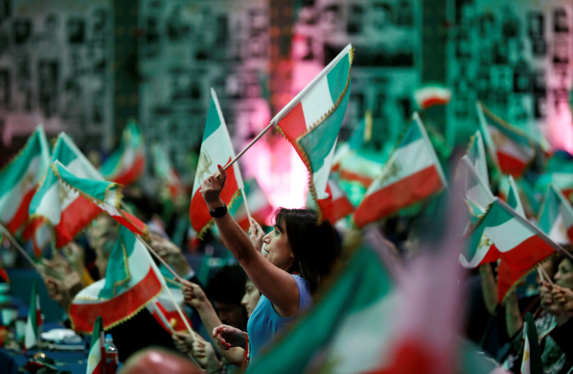 Attendees wave flags as Iranian Americans from across California converge in Los Angeles to participate in the California Convention for a Free Iran and to express support for nationwide protests in Iran from Los Angeles, California, U.S., January 11, 2020. (photo credit: REUTERS/ PATRICK T. FALLON)