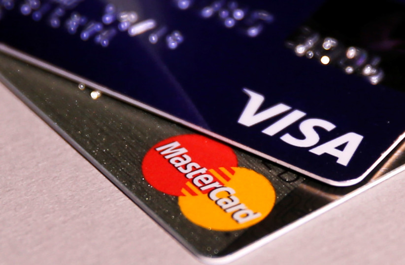 MasterCard and VISA credit cards are seen in this picture illustration taken June 9, 2016 (credit: MAXIM ZMEYEV/REUTERS)