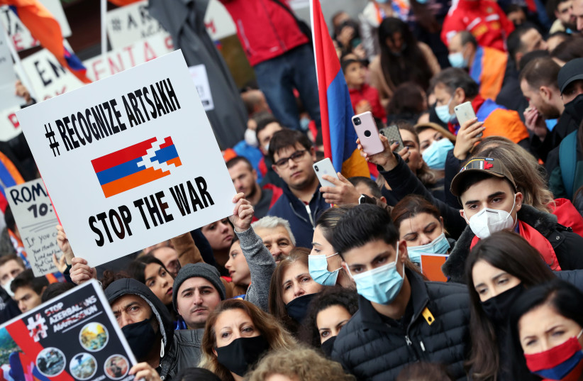 People supporting Armenia protest against the military conflict with Azerbaijan over the breakaway region of Nagorno-Karabakh, in Brussels, Belgium October 7, 2020 (credit: YVES HERMAN/REUTERS)