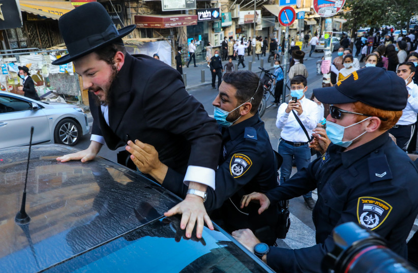 POLICE IN Jerusalem detain a haredi protester last week. (credit: MARC ISRAEL SELLEM/THE JERUSALEM POST)