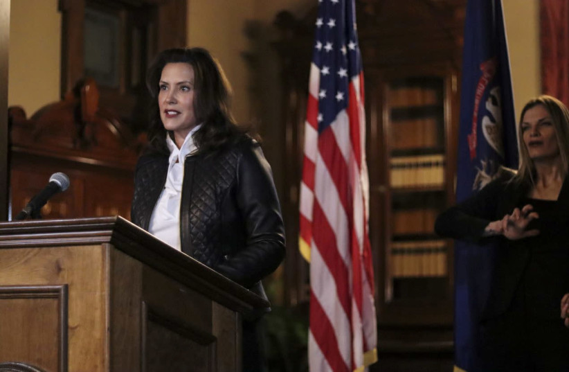 Michigan Governor Gretchen Whitmer speaks during a news conference after thirteen people, including seven men associated with the Wolverine Watchmen militia group, were arrested for alleged plots to take Whitmer hostage and attack the state capitol building, in Lansing, Michigan, U.S., October 8, 20 (credit: REUTERS)