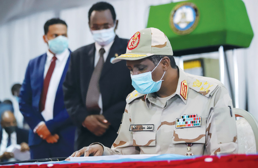 LT.-GEN. MOHAMED Hamdan Dagalo signs a peace agreement between Sudan’s power-sharing government and five key rebel groups, in Juba, South Sudan, on August 31, 2020. (credit: REUTERS)