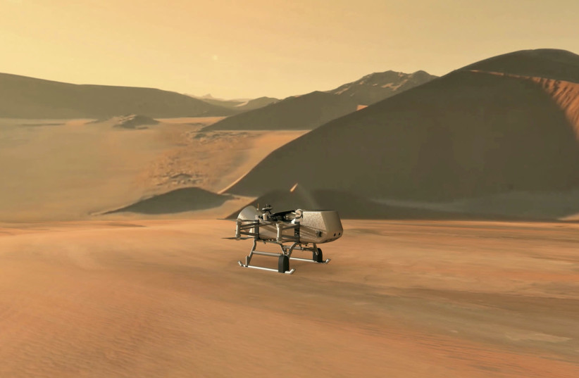 NASA's planned Dragonfly rotorcraft lander approaches a site to explore on Saturn's moon (photo credit: REUTERS)