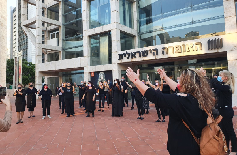 Singers from the opera chorus outside the Israeli Opera in Tel Aviv Wednesday (credit: Courtesy)