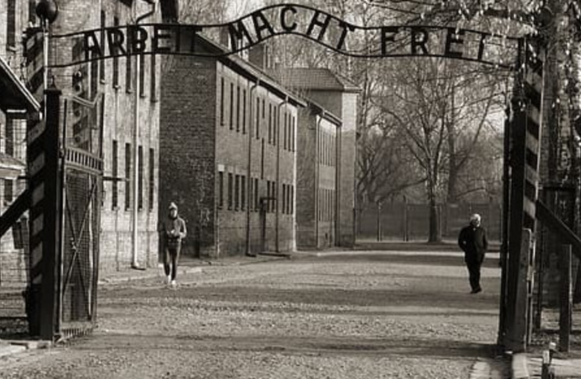 The main gate to Auschwitz with slogan 'Arbeit Macht Frei'