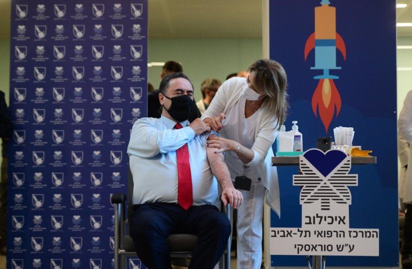 Minister Israel Katz is inoculated against the novel coronavirus on Sunday, December 20 (credit: MARC ISRAEL SELLEM)