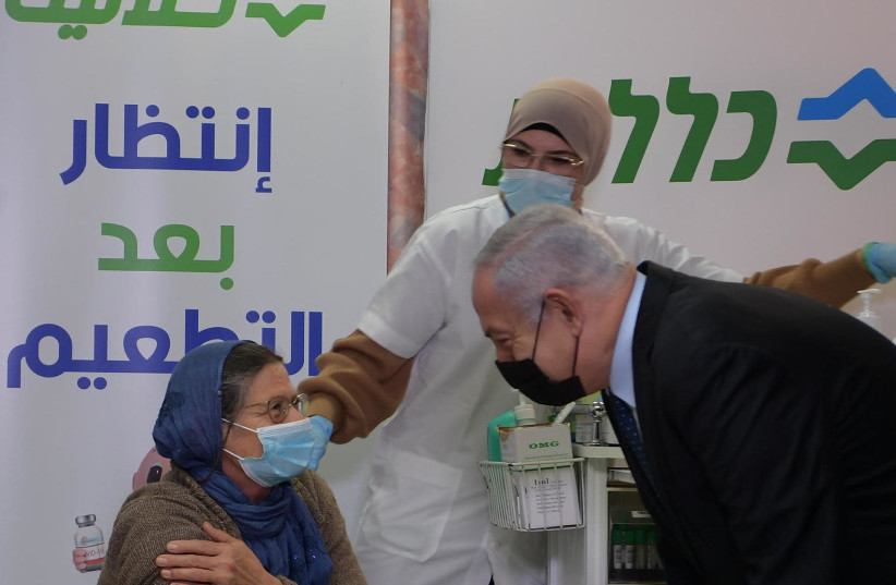 Prime Minister Benjamin Netanyahu visits a Clalit healthcare center in the Arab town Tira. (credit: AMOS BEN-GERSHOM/GPO)