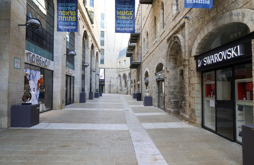 Jerusalem's Mamilla mall is seen nearly empty amid Israel's third coronavirus lockdown, on January 4, 2021. (credit: MARC ISRAEL SELLEM/THE JERUSALEM POST)