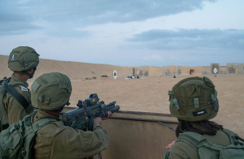 Soldiers from the IDF's Unit 585, primarily composed of Bedouins, are seen practicing firing. (credit: IDF SPOKESPERSON'S UNIT)
