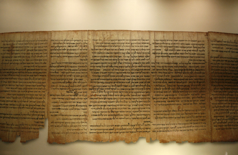 A facsimile of the Isaiah Scroll, one of the Dead Sea Scrolls, is displayed inside the Shrine of the Book at the Israel Museum in Jerusalem September 26, 2011. Developed in partnership with Google, the Israel Museum on Monday launched its Dead Sea Scrolls Digital Project, allowing users to explore t (credit: BAZ RATNER/REUTERS)