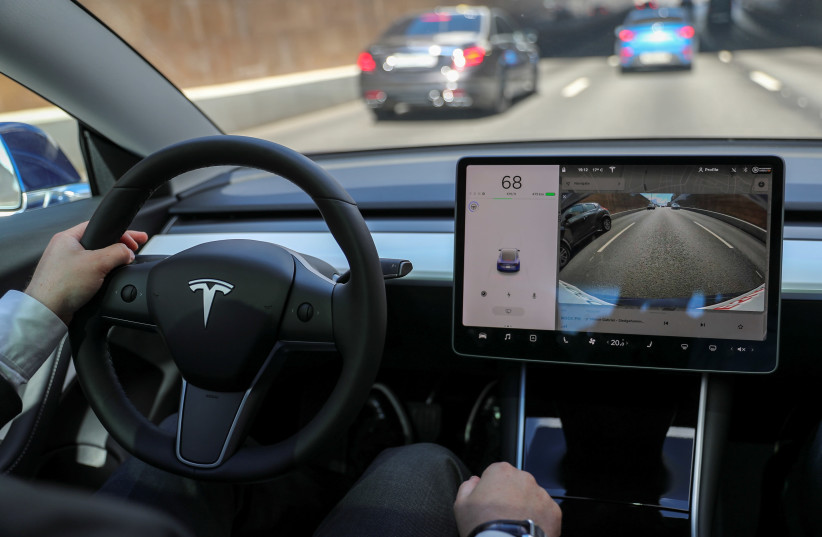 The interior of a Tesla Model 3 electric vehicle is shown in Moscow (credit: REUTERS)