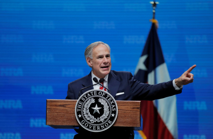 Texas Governor Greg Abbott speaks at the annual National Rifle Association (NRA) convention in Dallas, Texas, May 4, 2018 (photo credit: REUTERS/LUCAS JACKSON/FILE PHOTO)