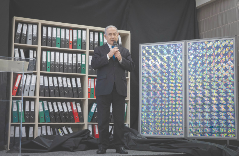 PRIME MINISTER Benjamin Netanyahu displays files that provided details of Iran’s nuclear program, at a press conference in Tel Aviv in 2018. (photo credit: MIRIAM ALSTER/FLASH90)