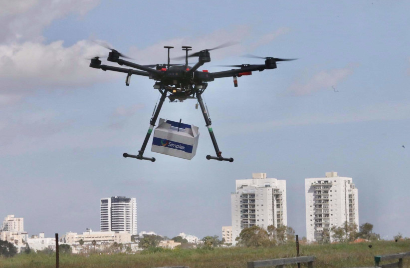 A drone delivery over Hadera  (credit: MARC ISRAEL SELLEM)