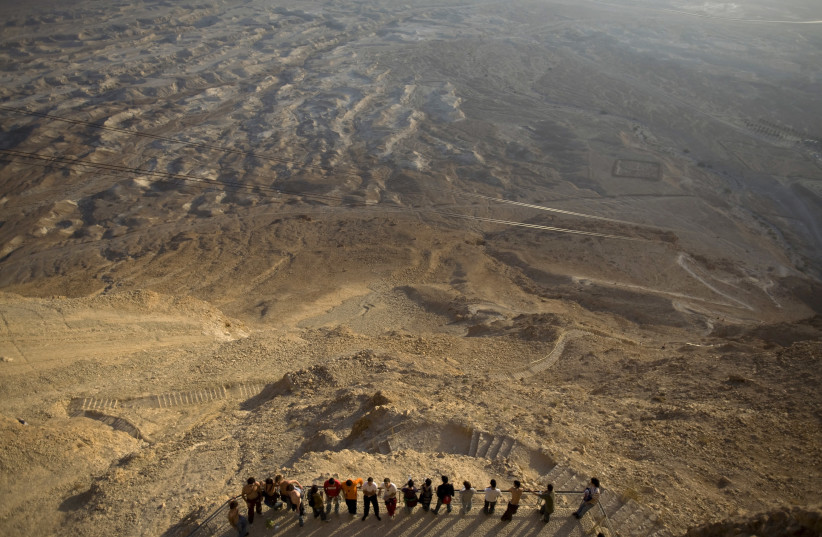 Tourists at Masada in 2008. The novel takes place during the Great Jewish Revolt against Rome, a war that ended at the battle of Masada. (credit: REUTERS)