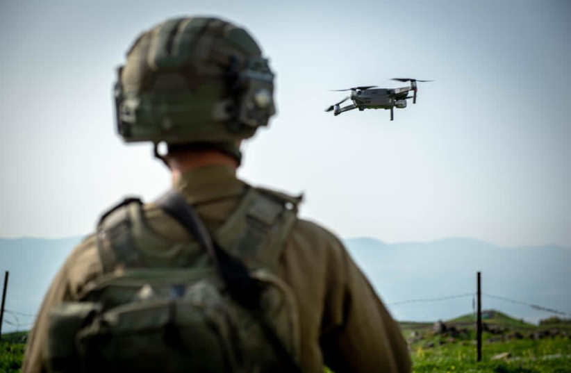 An Israeli soldier observes as a military drone takes off.  (credit: IDF)
