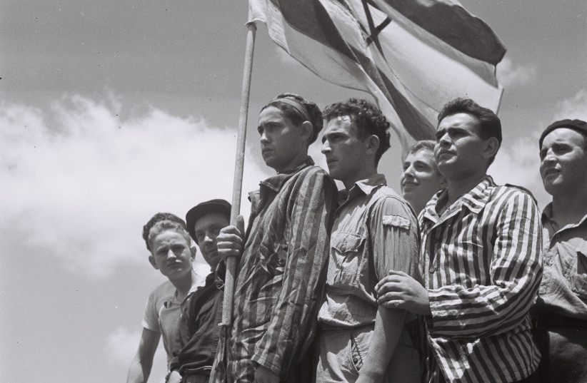 Buchenwald survivors arrive in Haifa to be arrested by the British, July 15, 1945, from ''To the Promised Land'' by Uri Dan (Doubleday, 1987) (credit: PUBLIC DOMAIN)