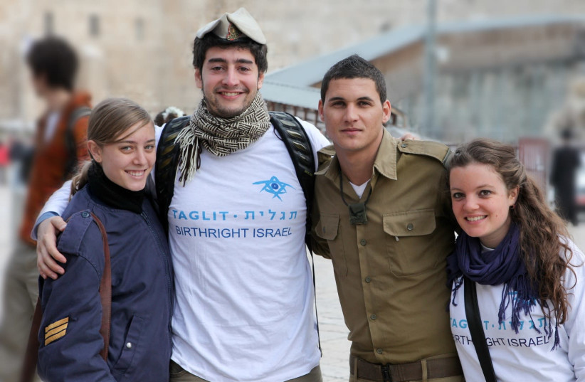 Birthright participants and IDF soldiers during a visit to Israel before the pandemic. (photo credit: EREZ UZIR)