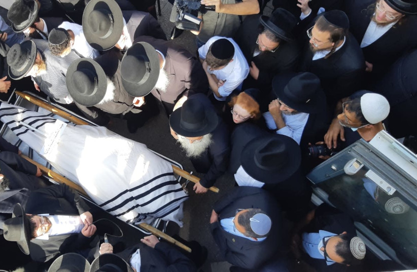 A funeral for one of the victims from the stampede that killed 45 and injured hundreds at Mount Meron on Lag Ba'Omer. (photo credit: MARC ISRAEL SELLEM)