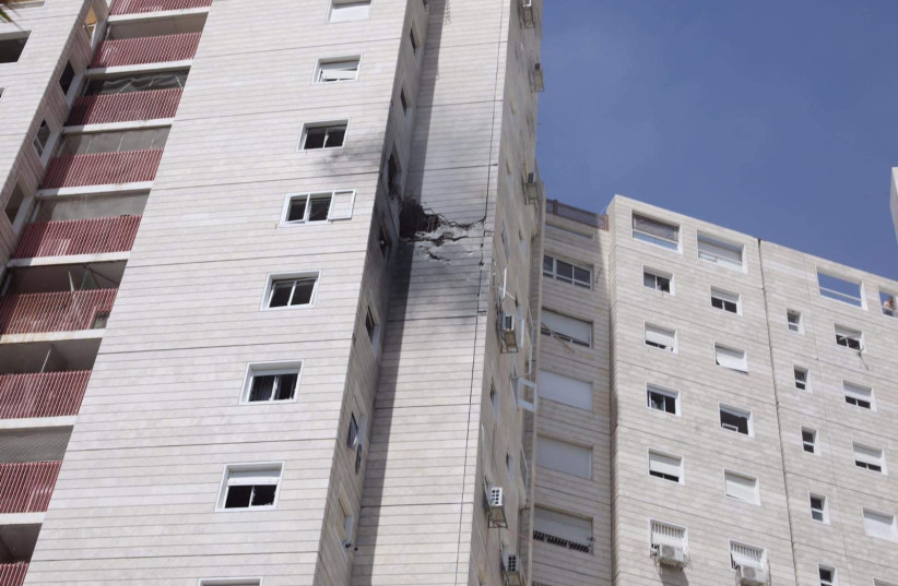 Rocket-hit building in Ashkelon (credit: MARC ISRAEL SELLEM/THE JERUSALEM POST)