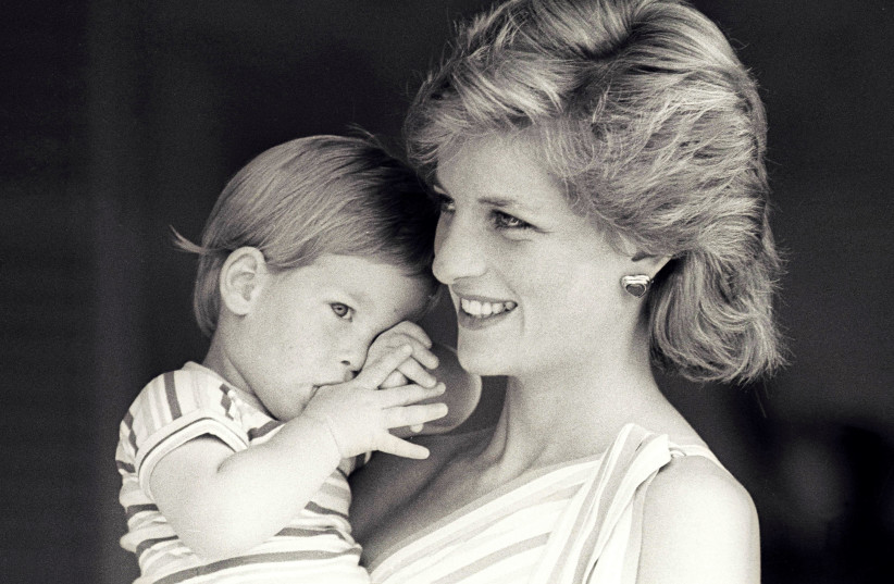 Britain's Princess Diana holds Prince Harry during a morning picture session at Marivent Palace, where the Prince and Princess of Wales are holidaying as guests of King Juan Carlos and Queen Sofia in Mallorca (credit: REUTERS)