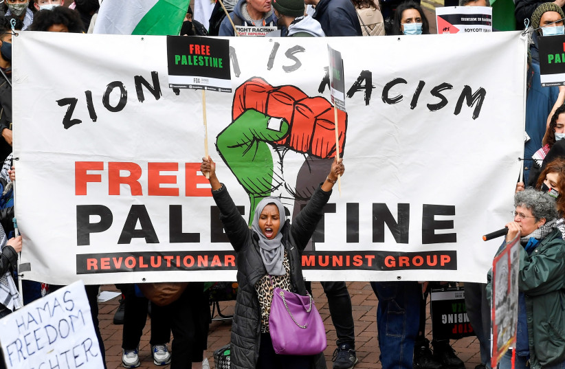 Pro-Palestinian demonstrators attend a protest following a flare-up of Israeli-Palestinian violence, in London, Britain May 22, 2021. (credit: TOBY MELVILLE/REUTERS)
