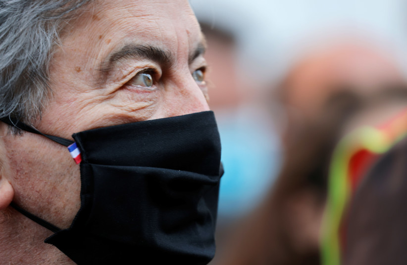Jean-Luc Melenchon, leader of far-left opposition La France Insoumise (France Unbowed) political party attends the traditional May Day labor union march, amid the coronavirus disease (COVID-19) outbreak in Lille, France, May 1, 2021. (photo credit: REUTERS/PASCAL ROSSIGNOL)