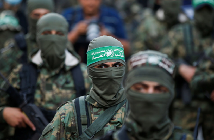 Palestinian Hamas militants take part in an anti-Israel rally in Gaza City May 22, 2021 (credit: REUTERS/MOHAMMED SALEM)