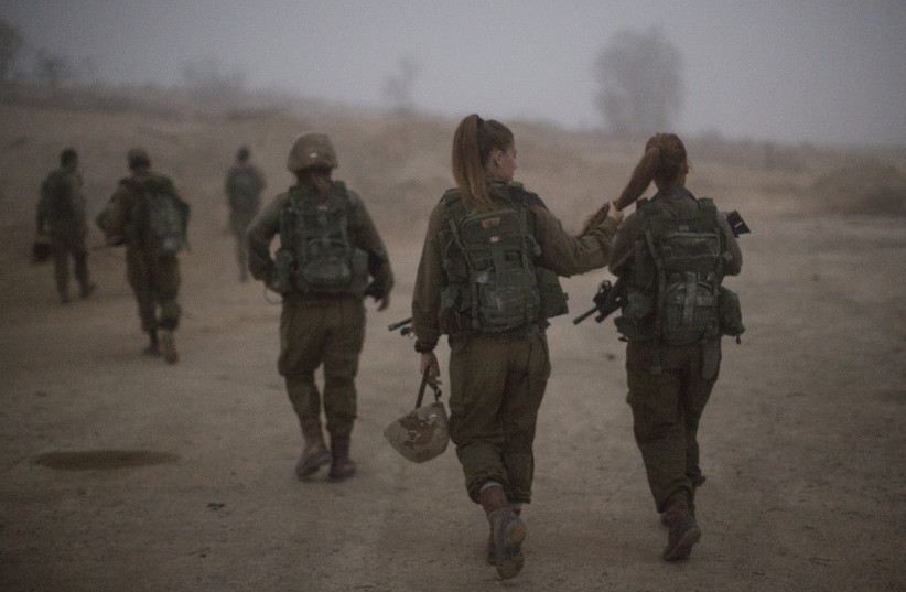 Female soldiers of the Bardales Battalion preparing for urban warfare training, near Nitzanim in the Arava area of Southern Israel.  (credit: HADAS PARUSH/FLASH90)