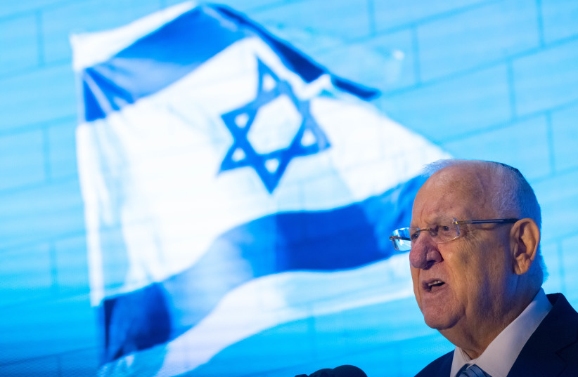 President Reuven Rivlin is seen speaking at a ceremony honoring IDF soldiers killed in the Second Lebanon War, at Mount Herzl in Jerusalem on June 24, 2021. (photo credit: OLIVIER FITOUSSI/FLASH90)